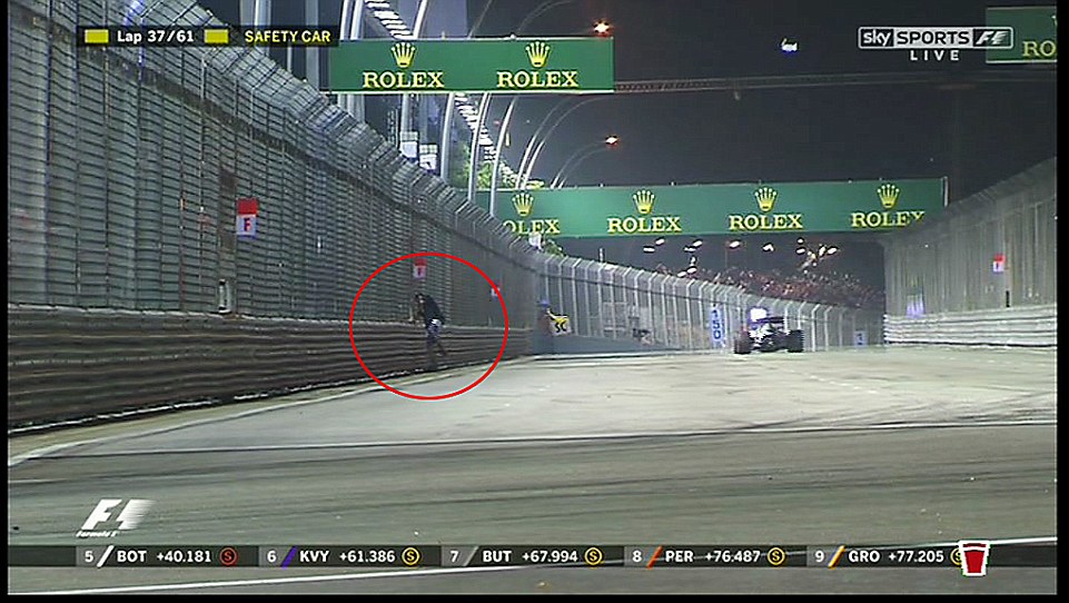 A man taking a casual stroll onto the Formula One track at Marina Bay prompted a safety car during the Singapore Grand Prix