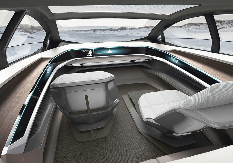 Концепт-кар Audi Aicon демонстрирует, каким может быть автомобиль будущего снаружи и изнутри. Салон больше напоминает кабинет или гостиную. За основу взят Audi A8 с автопилотом 3-го уровня, который уже сегодня умеет маневрировать без участия человека.