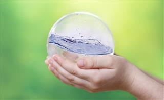 Water globe in childs hand