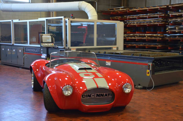 3D-printed Shelby Cobra next to a Big Area Additive Manufacturing system. (Image courtesy of Cincinnati Incorporated.)