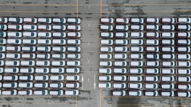 Aerial view new car lined up in the port for import and export business logistic to dealership for sale, Automobile and automotive royalty free stock photo