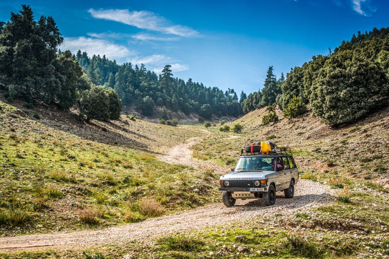 Azrou, Morocco - October 04, 2013. Old vintage off road car going on the dirt road.  stock image