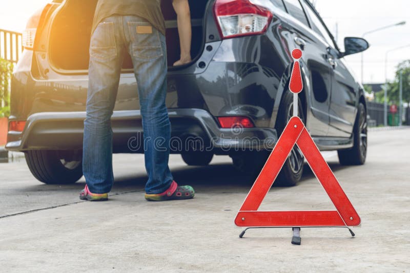 Broken car sign on a road. With a broken down car stock image
