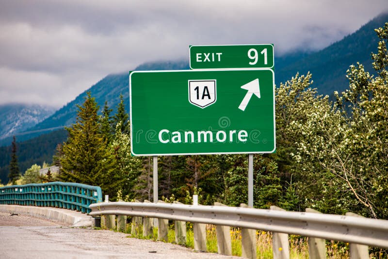 Canmore next exit after 91 km road sign stock photos