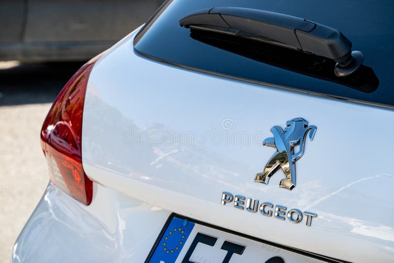 The logo of the Peugeot automotive company on a rear part of a modern white SUV 2008. CEFALU, SICILY - FEBRUARY 11, 2020: The logo of the Peugeot automotive stock photos