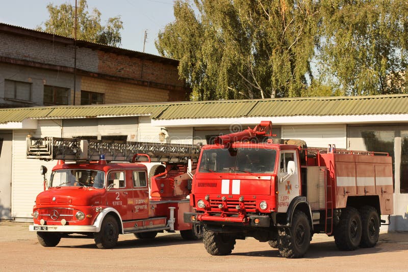 Chernihiv, Ukraine: July 31, 2019: Old fire truck. Big red Mercedes. Two fire trucks. Red Kamaz. Old fire truck. Big red Mercedes. Two fire trucks. Red Kamaz stock image