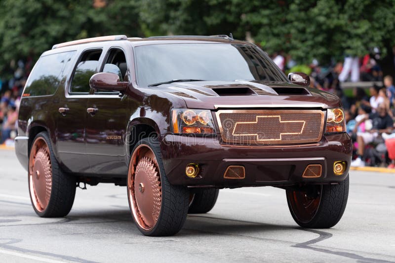 Circle City Classic Parade. Indianapolis, Indiana, USA - September 28, 2019: The Circle City Classic Parade, A donked Chevrolet SUV going down Pennsylvania royalty free stock photography