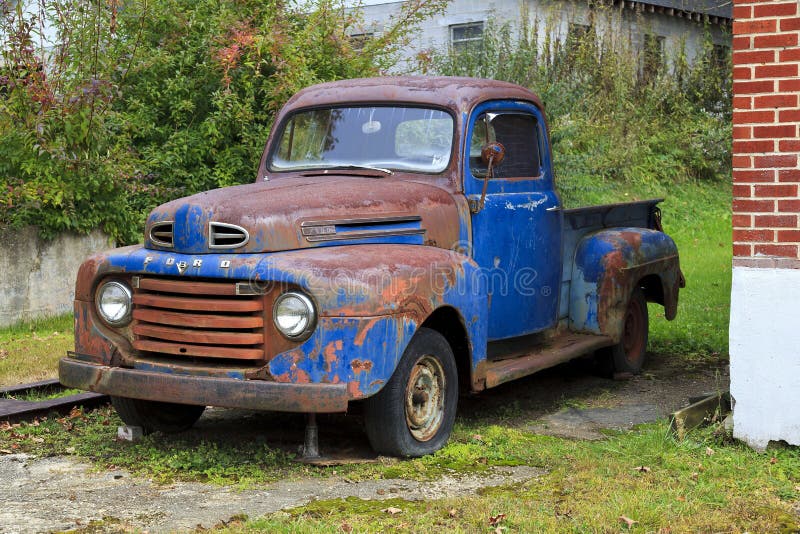 Classic Old Ford Pickup. Rusty blue, classic old Ford pickup truck front view stock photography