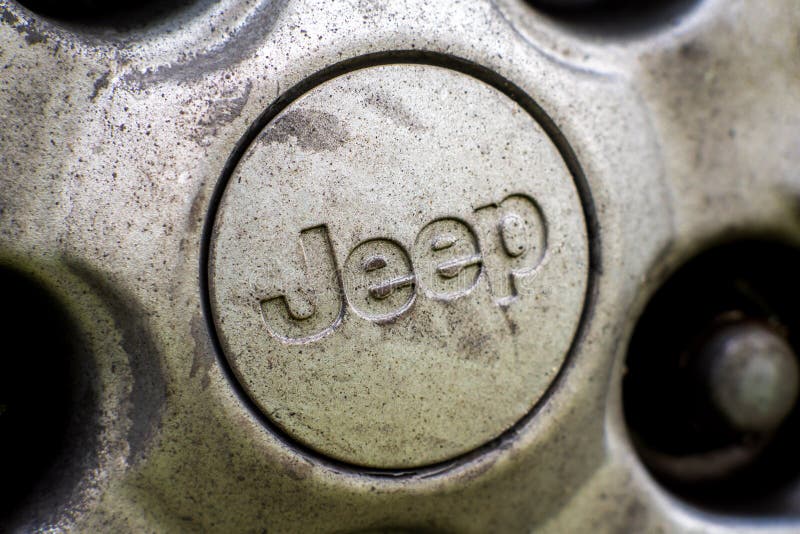 Close up of Jeep logo on the old SUV wheel. Jeep is a brand of American automobiles. Tallinn / Estonia - Mai 16, 2020: Close up of Jeep logo on the old SUV wheel royalty free stock images