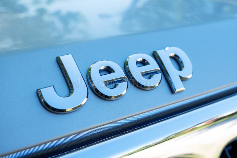 Close up of Jeep logo on the SUV auto. Jeep is a brand of American automobiles, FCA US LLC. Tallinn / Estonia - June 23, 2020: Close up of Jeep logo on the SUV royalty free stock image