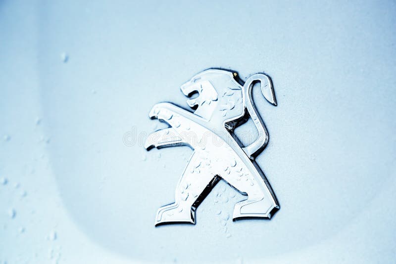 Close-up of the logo placed on the front bumper of the blue Peugeot SUV car. Cognac, France - February 21, 2020:close-up of the logo placed on the front bumper stock images