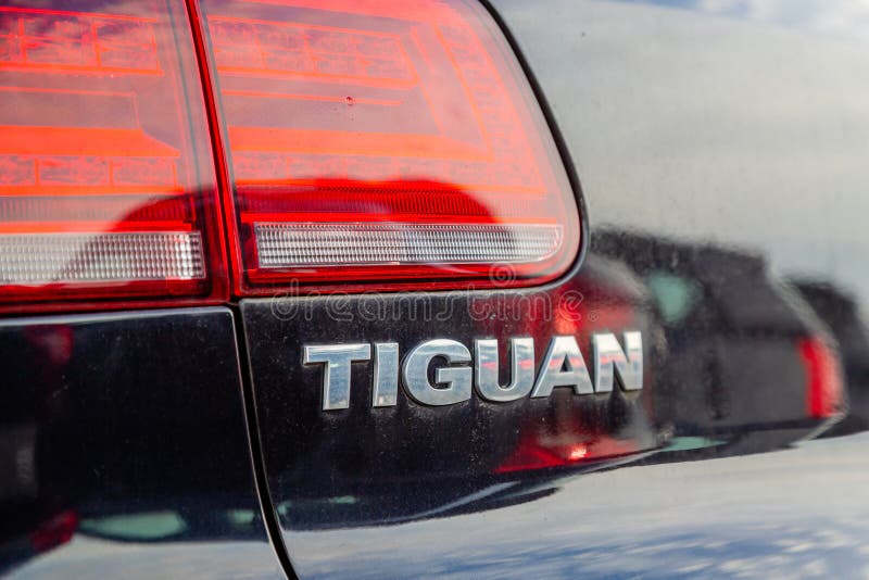 Close-up of the Logo Tiguan placed on the back of the Volkswagen SUV car. Cognac, France - February 16, 2020:Close-up of the Logo Tiguan placed on the back of royalty free stock photo