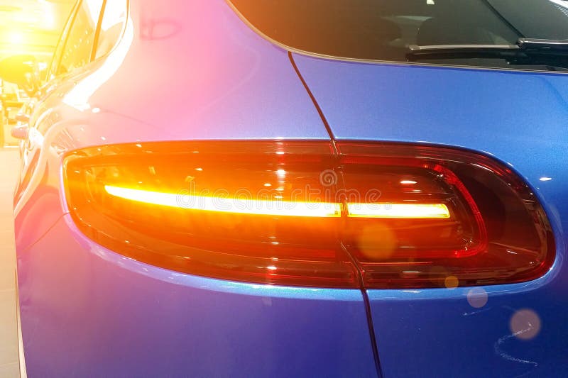 Close up of the and taillights of the premium blue SUV crossover Rear right view.  stock images