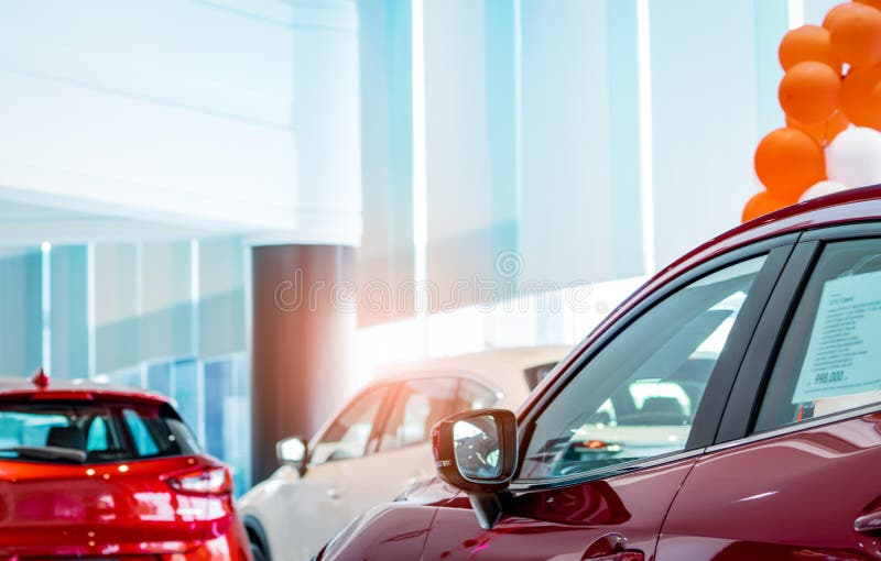 Closeup luxury SUV car parked in modern showroom. Red SUV car in showroom. Car dealership concept. Automotive industry. Electric. Car business and technology stock photography