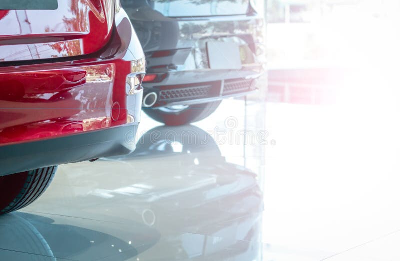 Closeup luxury SUV car with sport design parked in modern showroom. Rear view of red shiny SUV car in showroom. Car dealership. Concept. Automotive industry stock photos