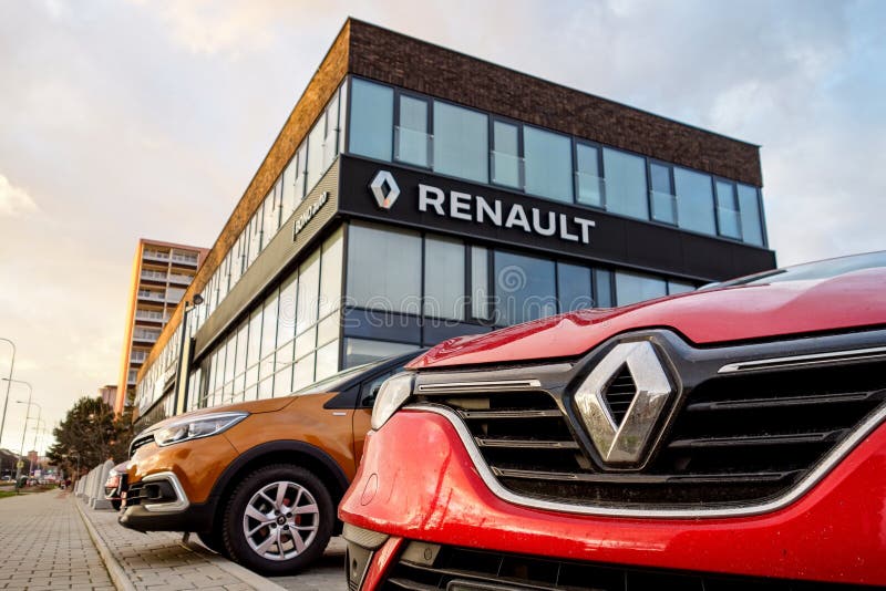 The detail of badge and frontal part of red Renault Captur SUV in front of the Dacia - Renault dealership which sells these. OSTRAVA, CZECH REPUBLIC - DECEMBER royalty free stock photography