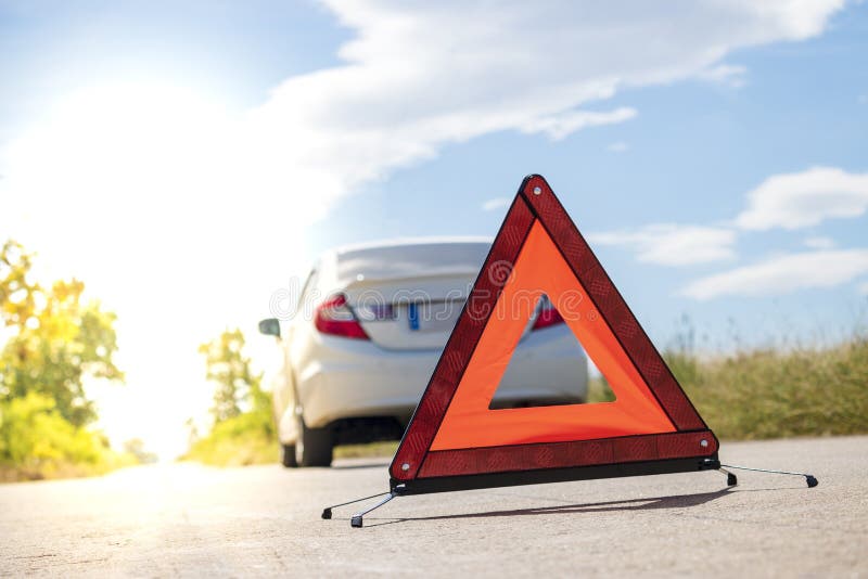 Emergency stop sign near broken car on road. Emergency stop sign near broken car on road stock photos