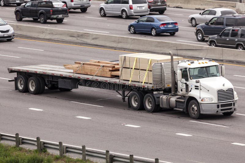 Flatbed Semitrailer Truck on the highway royalty free stock image