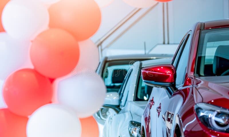 Front view of red SUV car in showroom. New luxury car parked in modern showroom for sale. Car dealership office. Automobile retail. Shop. Electric car royalty free stock photos