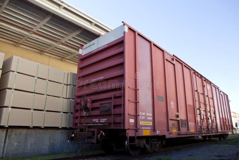 Industrial railway carriage transporting Lumber by rail royalty free stock images
