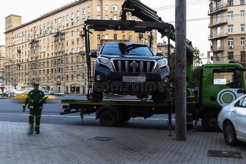 Moscow;Russia,September -first-Two thousand sixteen year;working of  tow truck  ,car evacuation for parking violation royalty free stock photography