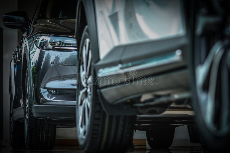 New luxury black shiny SUV compact car parked in modern showroom. Car dealership office. Car retail shop. Electric car technology. And business concept royalty free stock images