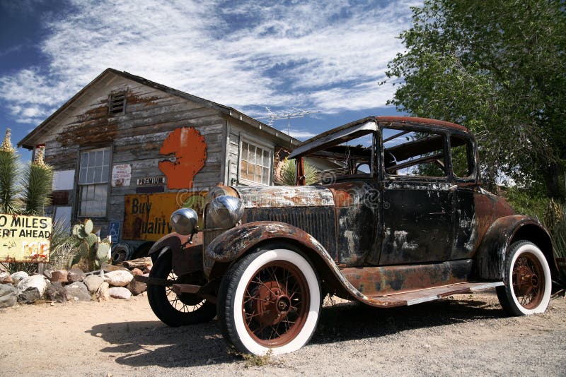 Old american ford beside vintage house. The old american ford beside vintage house royalty free stock photography