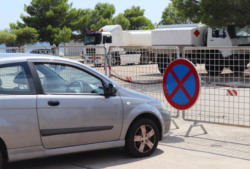 Parking a car in a prohibited place. Road signs and markings. Evacuation of the vehicle. Violation of the rules of the road. Ban s. Top and block the passage stock photography