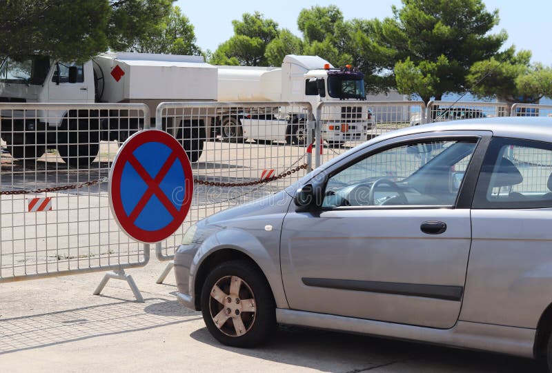 Parking a car in a prohibited place. Road signs and markings. Evacuation of the vehicle. Violation of the rules of the road. Ban s royalty free stock photo