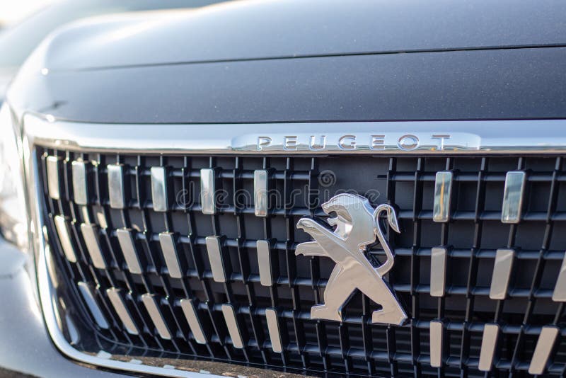 Peugeot logo on the front of a new SUV. Redesigned front grill wither silver highlights stock image