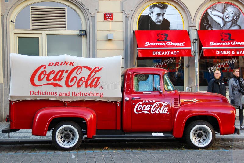 PRAGUE, CZECH REPUBLIC - Oct 23 2015: An old renovated red Ford vintage Coca cola truck (pickup) in a parking lot. PRAGUE, CZECH REPUBLIC - Oct 23 2015: An old royalty free stock photos