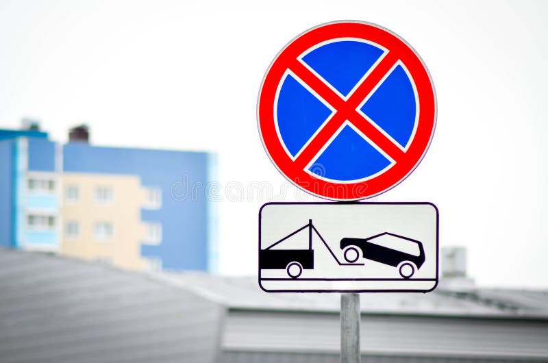 Road signs Parking prohibited and Evacuation of vehicles. In the urban background stock image