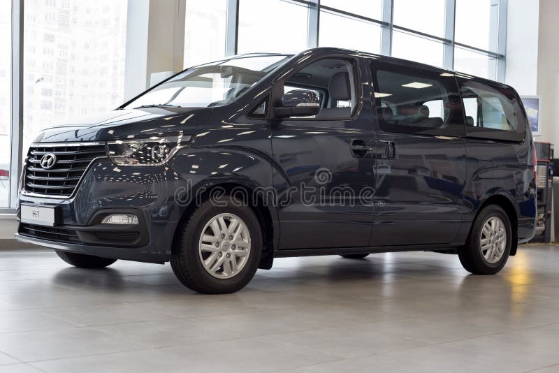 Russia, Izhevsk - January 23, 2020: New minibus H-1 in the Hyundai showroom. Famous world brand. Prestigious vehicles royalty free stock photos