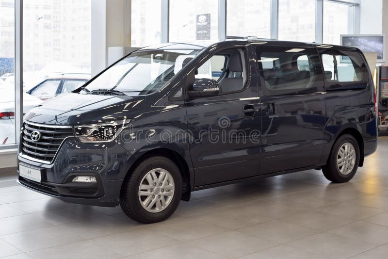 Russia, Izhevsk - January 23, 2020: New minibus H-1 in the Hyundai showroom. Famous world brand. Prestigious vehicles stock image