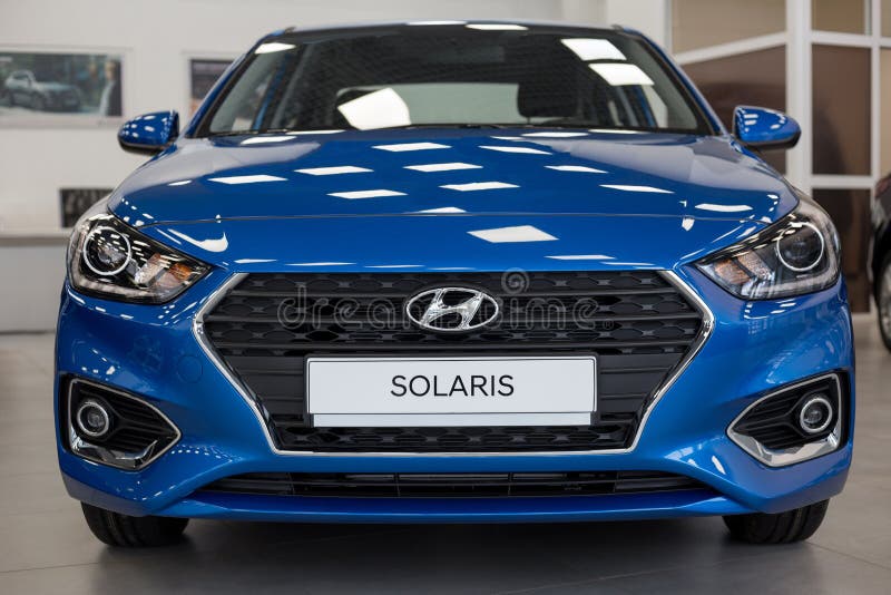 Russia, Izhevsk - January 23, 2020: New modern Solaris car in the Hyundai showroom. Famous world brand. People`s car stock images