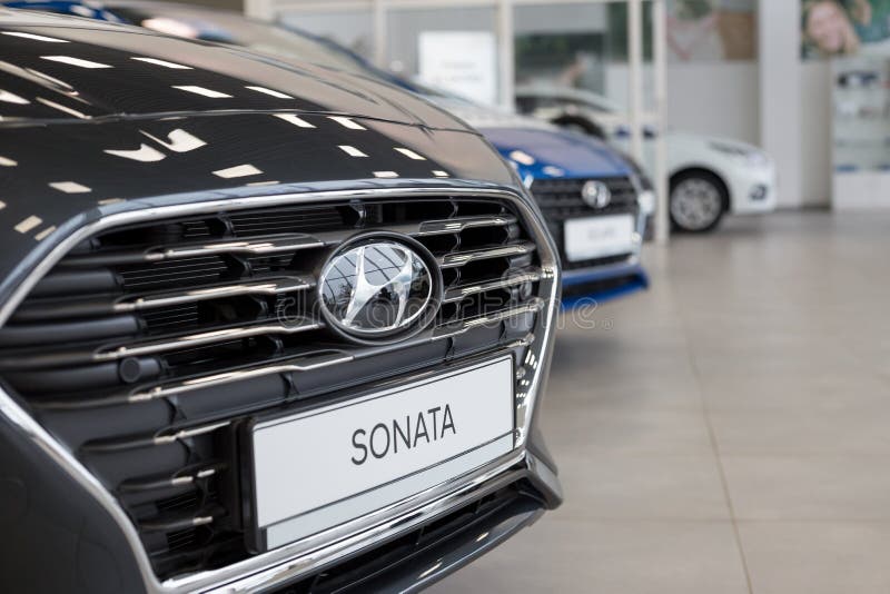 Russia, Izhevsk - January 23, 2020: New Sonata and other cars in the Hyundai showroom. Famous world brand. Prestigious vehicles royalty free stock photography