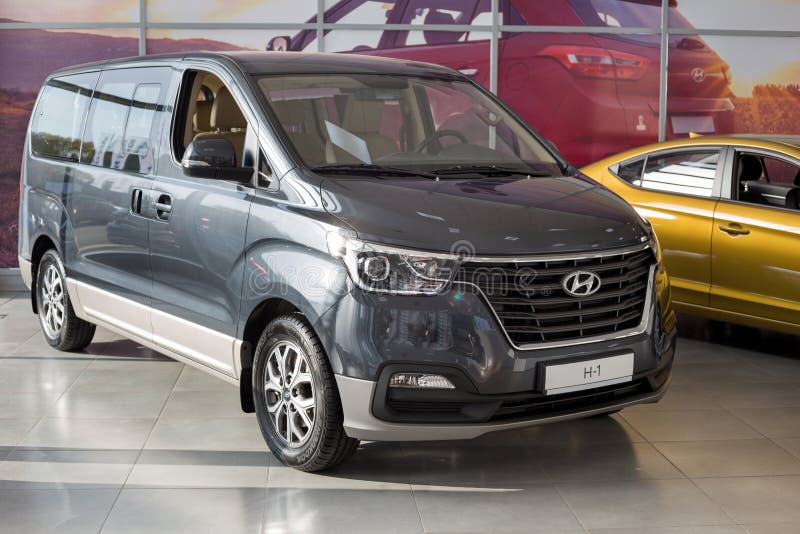 Russia, Izhevsk - October 30, 2019: New minibus H-1 in the Hyundai showroom. Famous world brand. Prestigious vehicles royalty free stock photo