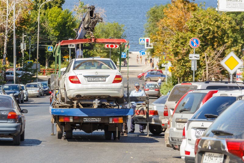 Evacuation from an expensive Mercedes car for an incorrect parking. Russia, Samara, August 2017: evacuation from an expensive Mercedes car for an incorrect royalty free stock images