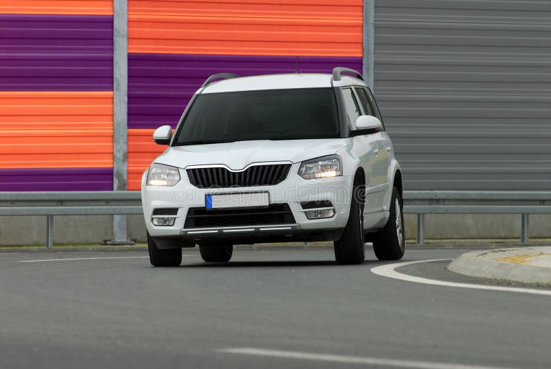 SUV driving too fast. SUV going at high speed cornering stock image