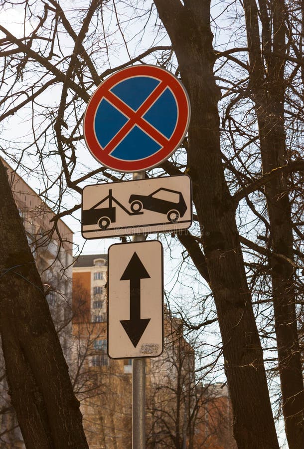 Traffic road sign Parking prohibited with Direction of sign. Evacuation on tow truck. Traffic road sign prohibiting parking Parking prohibited with information royalty free stock image