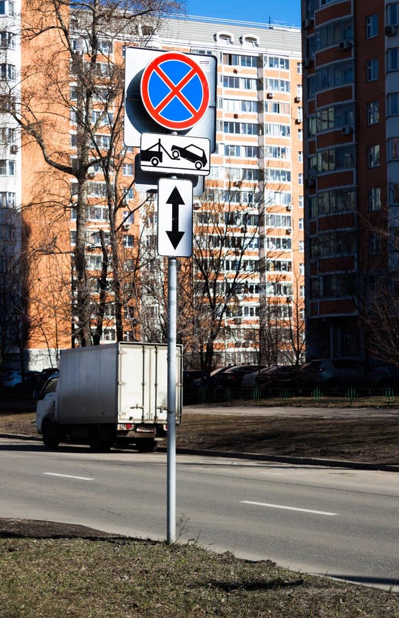 Traffic road sign Parking prohibited with Direction of sign. Evacuation on tow truck. Traffic road sign prohibiting parking Parking prohibited with information stock photo