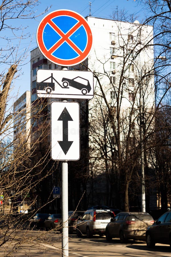 Traffic road sign Parking prohibited with Direction of sign. Evacuation on tow truck. Traffic road sign prohibiting parking Parking prohibited with information royalty free stock images