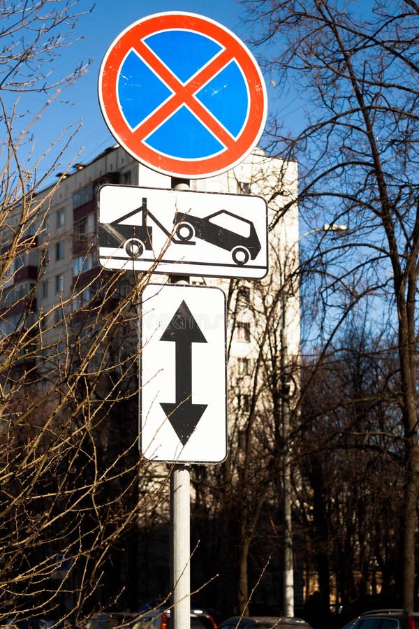 Traffic road sign Parking prohibited with Direction of sign. Evacuation on tow truck. Traffic road sign prohibiting parking Parking prohibited with information royalty free stock photography