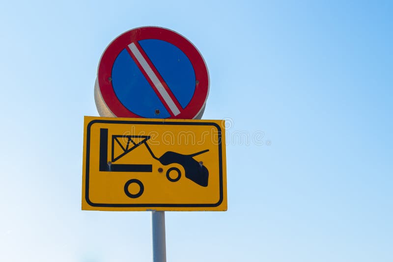 Traffic sign - No Parking zone, evacuation on tow truck. Prohibited and tow away zone.  royalty free stock image