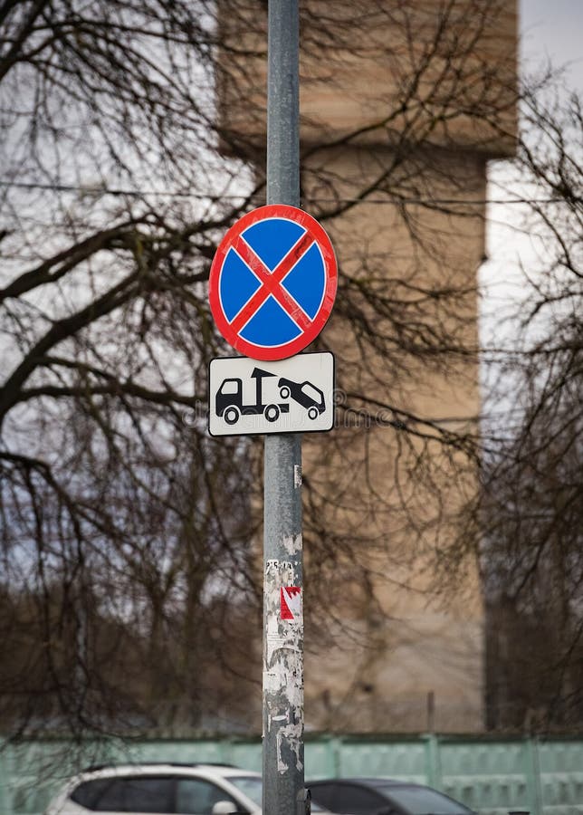 Traffic sign warning no parking and car evacuation. From the city street royalty free stock photo