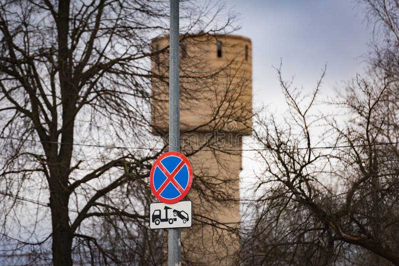 Traffic sign warning no parking and car evacuation. From the city street royalty free stock photography