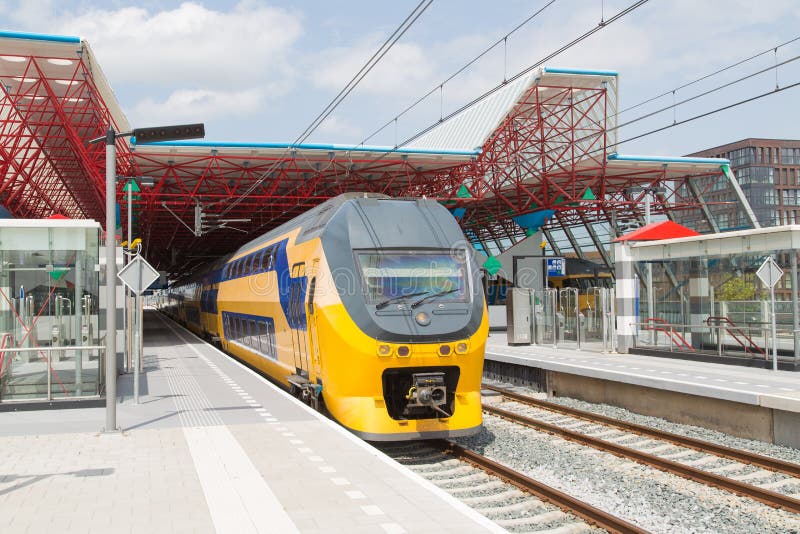Train at the central station of a Dutch city royalty free stock photos