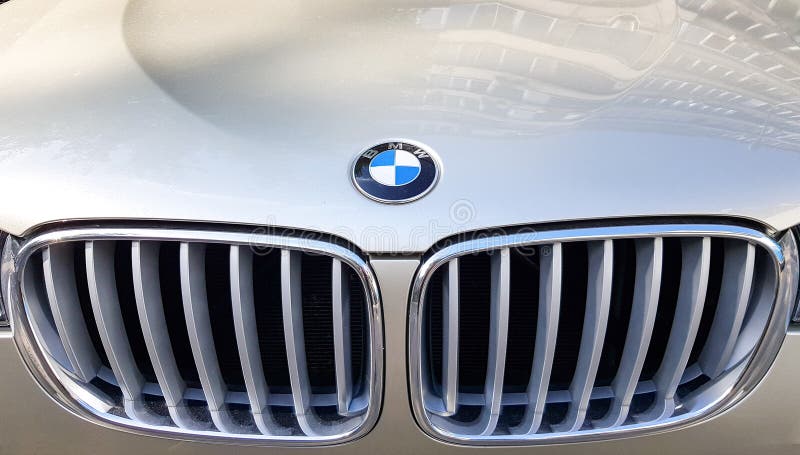 Ukraine, Kiev - June 16, 2019: View of the front grille of a BMW. Prestigious car brand. Close-up grille of a golden SUV car. Logo. BMW X5 sign stock images