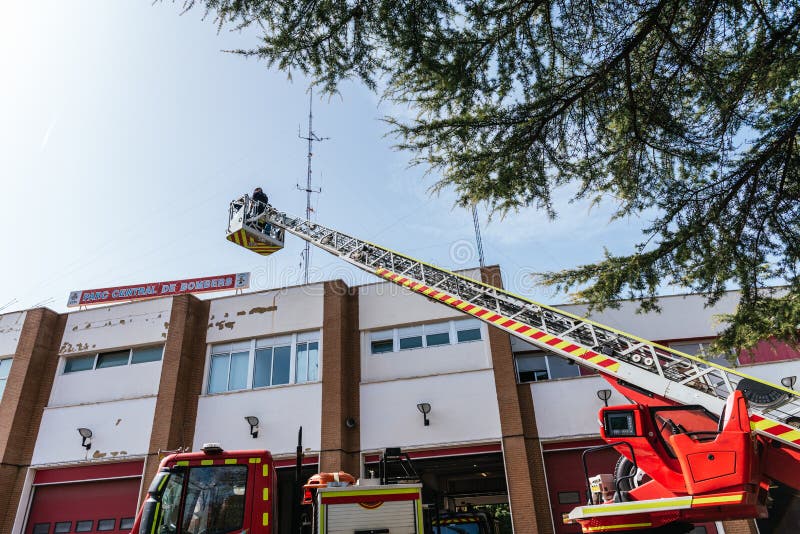 Valencia, Spain - February 29, 2020: Firefighters of the city of Valencia demonstrating the use of the truck ladder stock photo