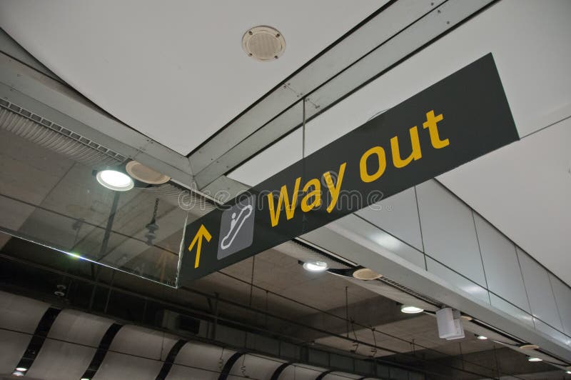 Way out emergency evacuation exit sign arrow direction. In the train station royalty free stock images